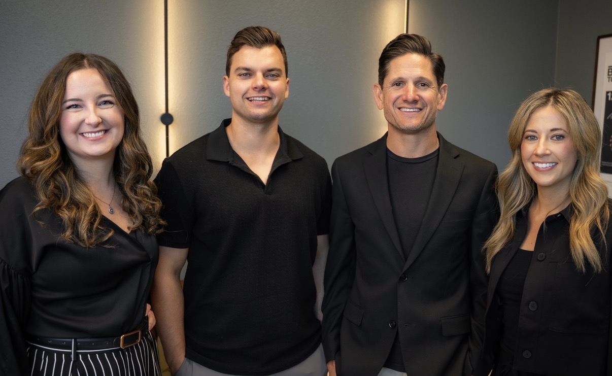 Adam Kasick and the wealth management team in their office